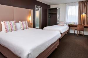 เตียงในห้องที่ Campanile Hotel - Birmingham