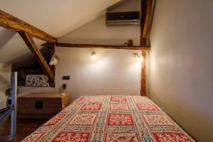 a bedroom with a large bed in a attic at JV Art Studio in Sofia