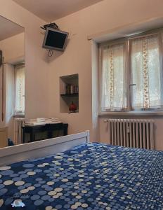 Televízia a/alebo spoločenská miestnosť v ubytovaní Ale&Andrea Apartments BLU & LILLA