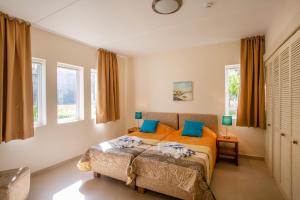Postel nebo postele na pokoji v ubytování Blue Bay Beach Apartments
