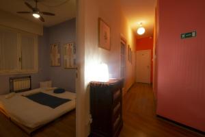 A bed or beds in a room at Il Riposo del Guerriero Guesthouse