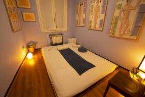 A bed or beds in a room at Il Riposo del Guerriero Guesthouse