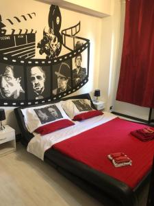 a bedroom with a large bed with a poster on the wall at B&B Il Sognatore in Perugia