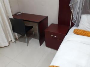 Postel nebo postele na pokoji v ubytování Delight Lodge