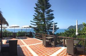 a large stone patio with a view of the ocean at HIP Seaview Resort @ Phi Phi in Phi Phi Islands