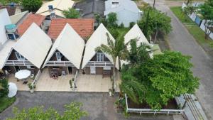 an aerial view of a house with white roofs at Cabanas da Vó Nena in Palhoça