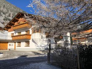 a building with a fence in front of it at Haus Grassa in Brand