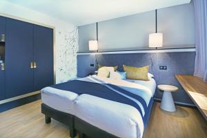 Postel nebo postele na pokoji v ubytování Hôtel Le Roosevelt Lyon + 37 fotografií