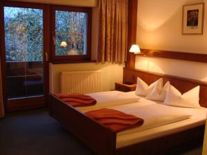 Posteľ alebo postele v izbe v ubytovaní Hotel Garni Schieferle