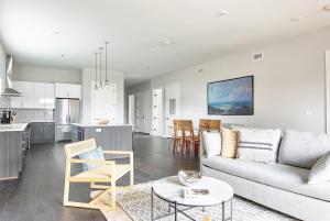 a living room and kitchen with a couch and a table at Sonder The Retreat in Nashville