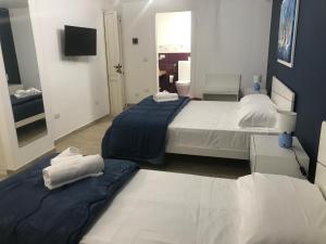A bed or beds in a room at B & B Vittorio Emanuele