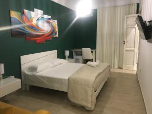 A bed or beds in a room at B & B Vittorio Emanuele