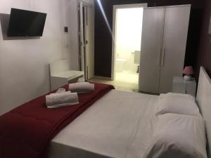 A bed or beds in a room at B & B Vittorio Emanuele