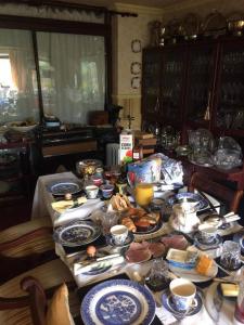 a table with plates of food on top of it at Ms McCreadys Guest House in Doncaster