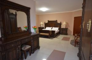 a bedroom with a bed and a large mirror at Teplice Plaza in Teplice