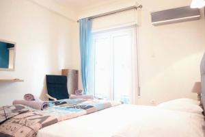 Posteľ alebo postele v izbe v ubytovaní Athens Central 2BD Apartment at Acropolis Plaka