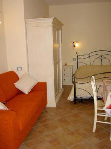 a living room with a couch and a table at Agriturismo Monteortone in Abano Terme