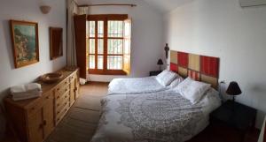 Posteľ alebo postele v izbe v ubytovaní Cortijo de Pipa