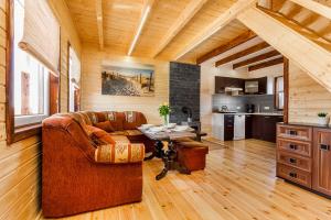 a living room with a couch and a table at Osada Chłapowo in Władysławowo