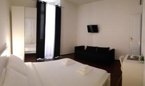 Tempat tidur dalam kamar di Cagliari d'Amare Via Roma