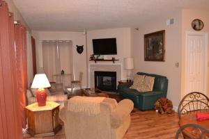 a living room with a couch and a fireplace at River Place Condos #411 3BD in Pigeon Forge