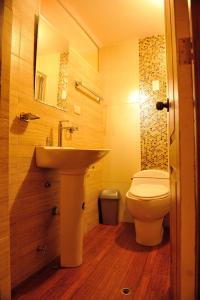 a bathroom with a sink and a toilet at Tambo del Solar in Arequipa