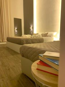Postel nebo postele na pokoji v ubytování La Banchina Holiday Rooms