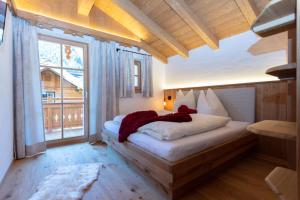 Posteľ alebo postele v izbe v ubytovaní Birnbaum Chalets Grossarl