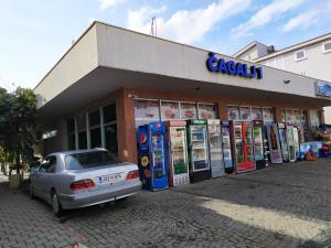 a car parked in front of a gas station at Guest House Star in Međugorje