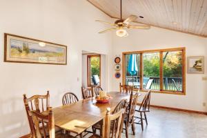 a dining room with a wooden table and chairs at Generations in Douglas