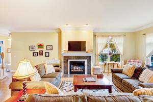 a living room with couches and a fireplace at Beacon Court D in Douglas