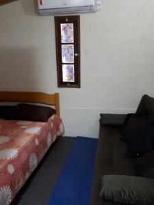 Voodi või voodid majutusasutuse Mini casa (kit net) toas