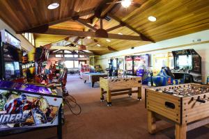 a room with arcade games and video games at Charming Studio Condo in Truckee