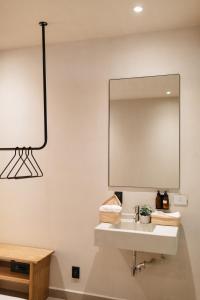 a bathroom with a sink and a mirror at Casa Pancha in Mexico City