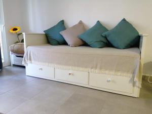 a couch with pillows on it in a room at GARDEN 128 in Corralejo +31 photos