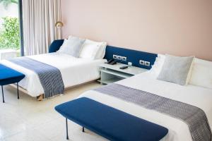 a hotel room with two beds and a window at Il Buongustaio in San Salvador +45 photos