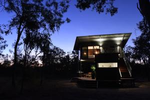 a house in the woods at night at Hideaway Litchfield in Rakula