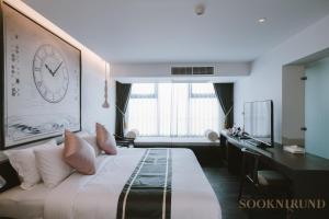 Ένα ή περισσότερα κρεβάτια σε δωμάτιο στο SOOKNIRUND HOTEL