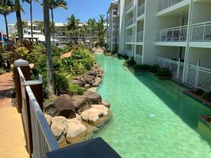 a pool in the middle of a resort at Alex beach resort unit 305 in Alexandra Headland
