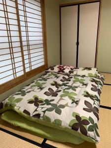 En eller flere senge i et værelse på 船堀ハウス