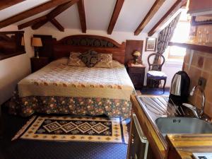 a bedroom with a bed and a sink and a tub at Studios Kono in Kotor +39 photos