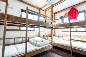 Postel nebo postele na pokoji v ubytování Sendai Guest House UMEBACHI