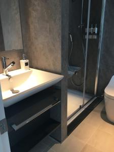 Vannituba majutusasutuses Hotel 草石庵