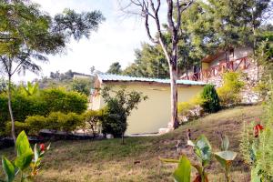 a view of the house from the garden at Astraal Resorts and Spa in Rishīkesh