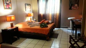 Letto o letti in una camera di Fare D'hôtes Tutehau