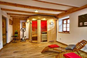 a living room with wooden floors and wooden ceilings at Das Wetterstein in Ehrwald