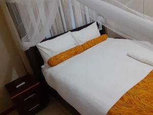 Postel nebo postele na pokoji v ubytování Delight Lodge