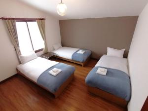 Un ou plusieurs lits dans un hébergement de l'établissement Annupuri Mountain View Lodge