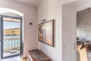 a living room with a view of the ocean at CAMARA SUITES in Andros