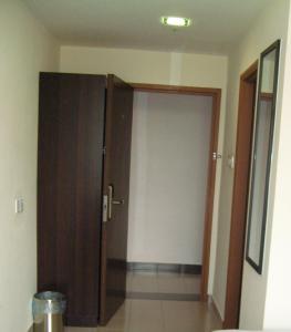 a door to a room with a door to a room at Hotel Orient in Johor Bahru